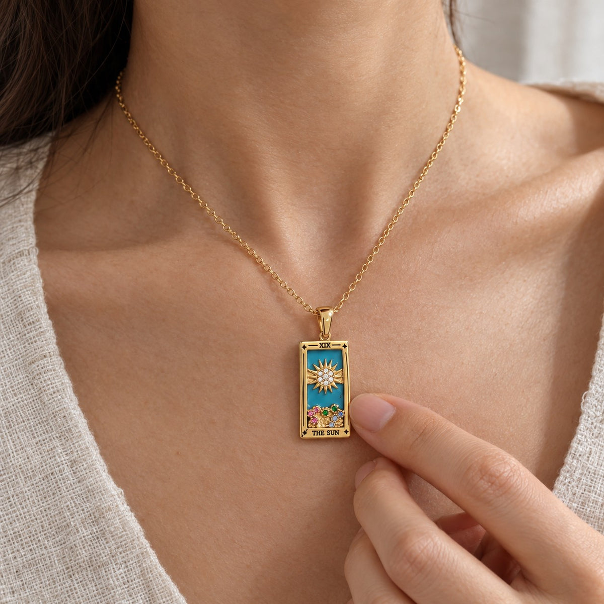 Gold Tarot Card Pendant Necklace - worn or held for scale