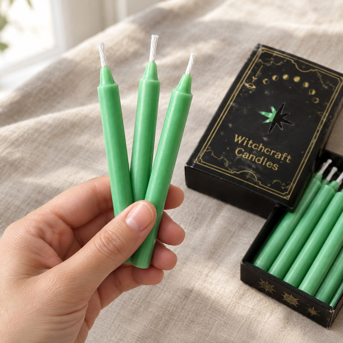 Green Ritual Candles (12 pack) - held in hand for scale