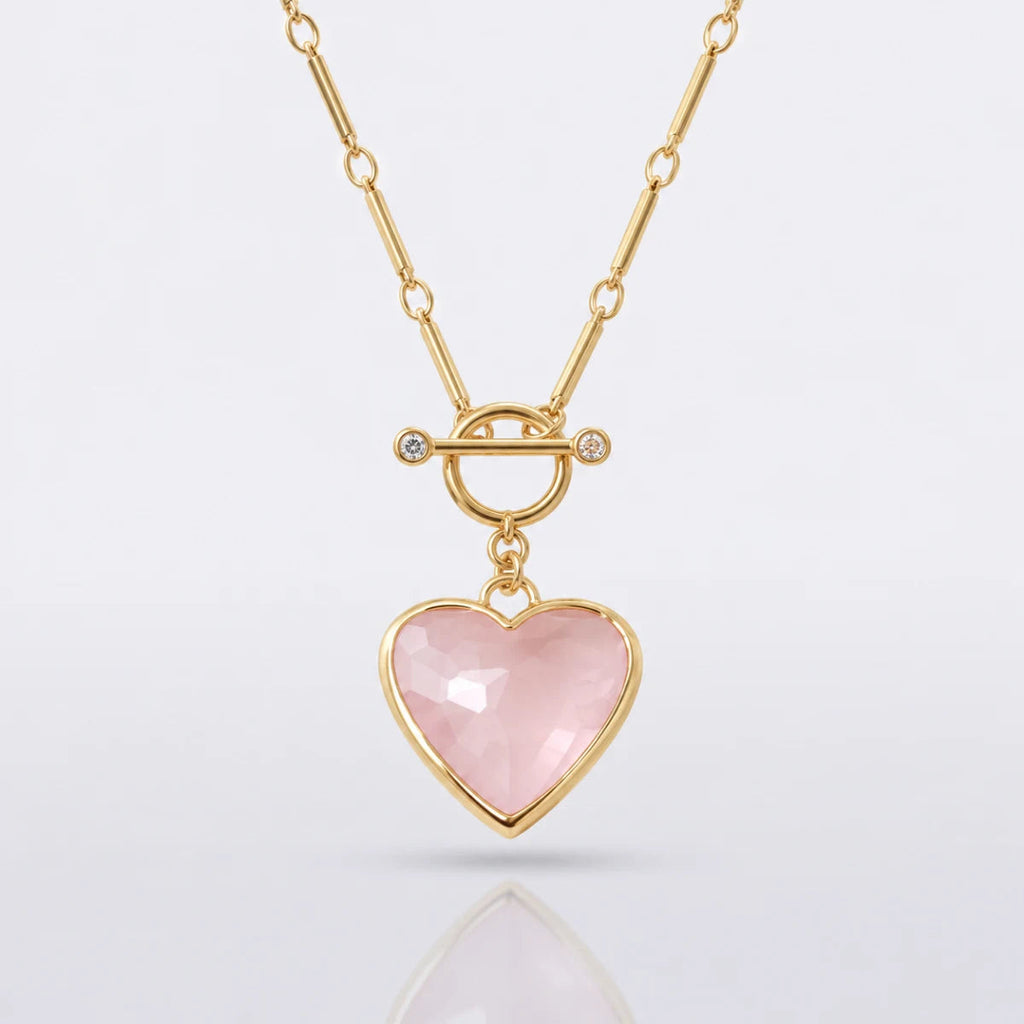 Pink faceted heart pendant and gold chain detail