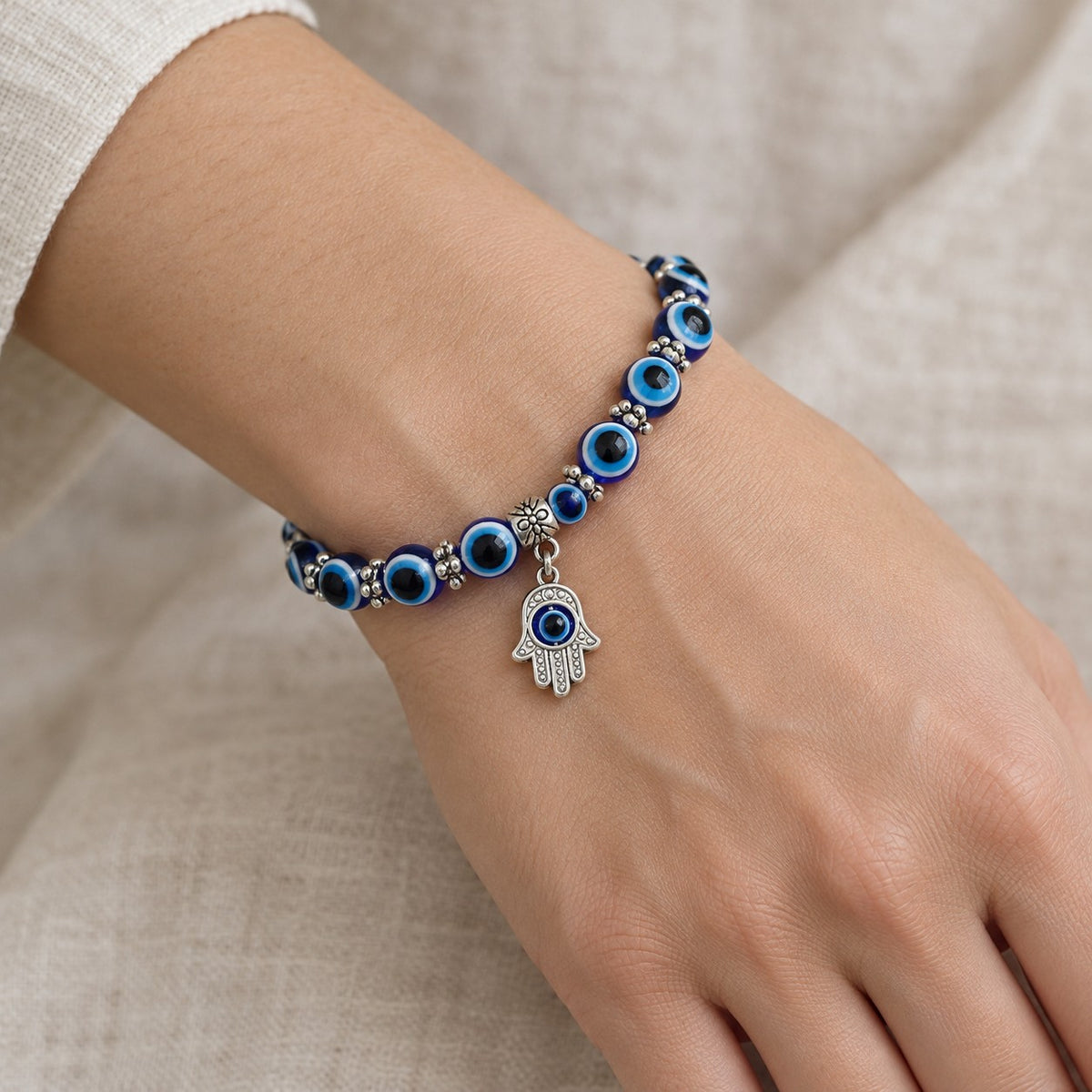 Turkish Evil Eye Charm Bracelet - worn or held for scale