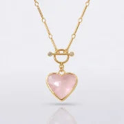 Close-up of the pink crystal heart, gold bezel and front toggle clasp